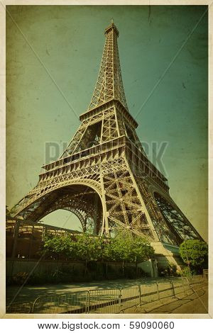 Eiffel tower. Photo in retro style. Paper texture.