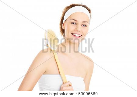 A picture of a woman doing peeling with a brush over white background