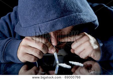 Sad Man Doing Sniffing Cocaine At Home On His Own