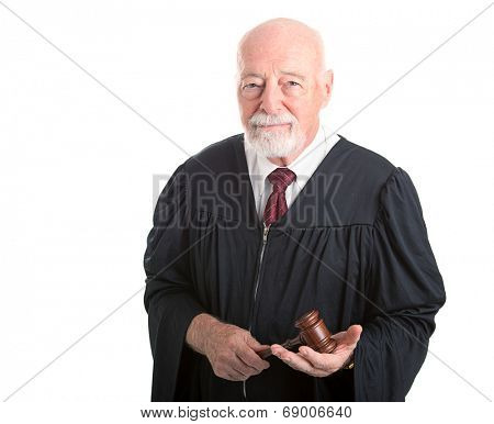 Serious dignified judge with gavel.  Isolated on white.  