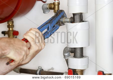 Man Is Working On A Heat