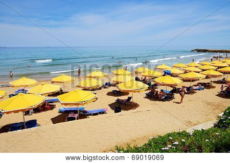 Crete, Greece - May 12: The Tourists Enjoiying Their Vacation On The Beach On May 12, 2014 In Crete,