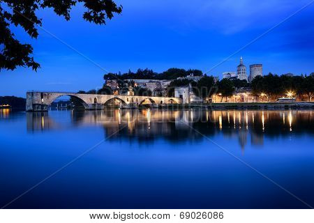 Avignon Bridge, France, viewed at night.  With the Papal Palace.