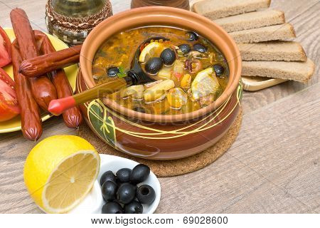 Dish Of Russian Hodgepodge Soup In Ceramic Pot.