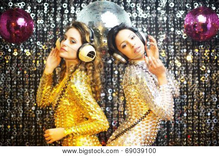 Two Beautiful Sexy Disco Women In Gold And Silver Catsuits Dancing