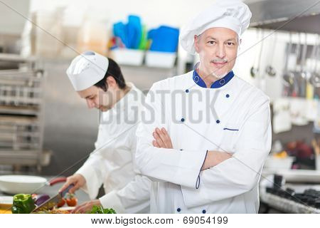 Portrait of a Chef at work in his Kitchen