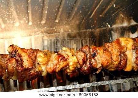 Excellent Skewers Of Meat Cooked On A Spit In The Fireplace 3