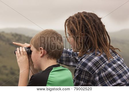 Two youth looking for Wildlife.