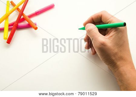 Male hand ready to create a draw