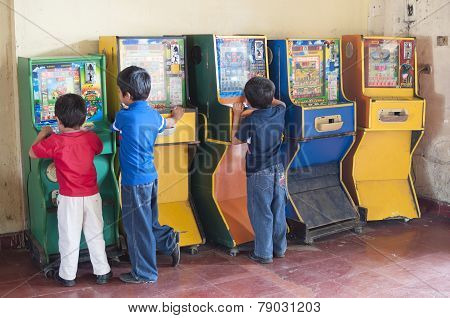 Children Playing Bingo Arcade Games