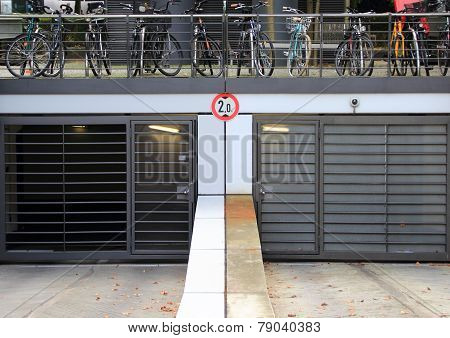 City Parkinglot Entrance With Bicycles On Top