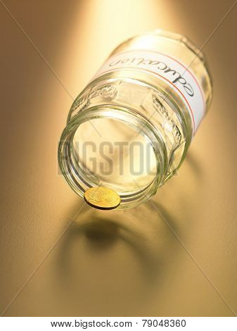the only coin resting on the jar labelled education