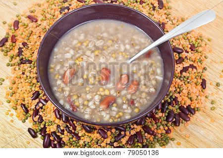 Top View Of Mess Of Pottage In Bowl With Tablespoon