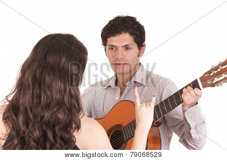 handsome man with guitar serenading young girl