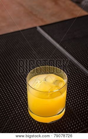 Screw Driver Cocktail On A Bar Ribber Mat