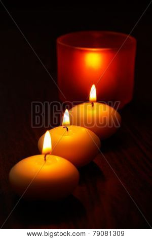 Glass Candlestick And Candles On Wooden Table