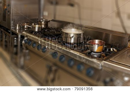Real restaurant kitchen shot in operation, tilt shift focus effect