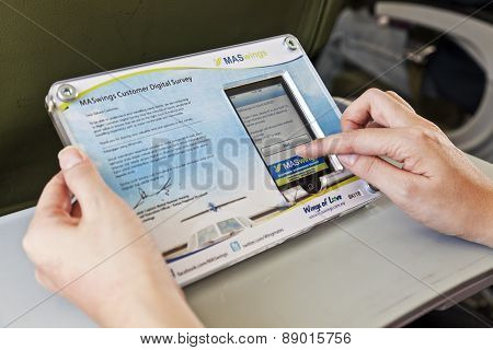 Completing a digital survey on an ipod