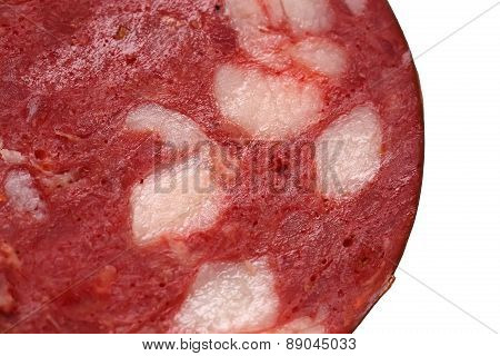Juicy Piece Of Sausage Isolated On White Background