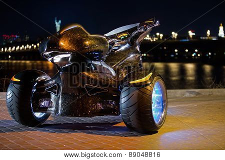 Black trike standing on the night street