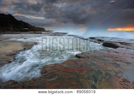 Waves Smash Against The Rocks At Coledale