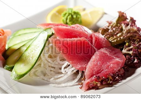 Tuna Sashimi - Sliced Raw Tuna on Daikon with Seaweed and Cucumber