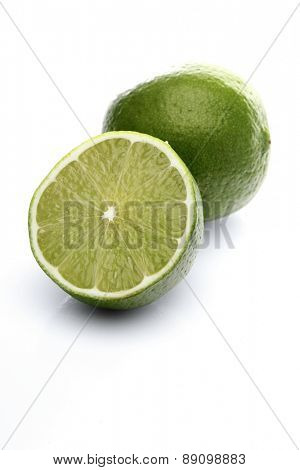 Limes on white background - close-up