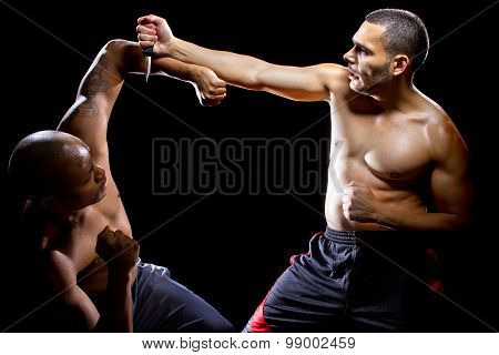 Martial Arts Instructor Demonstrating Knife Self Defense