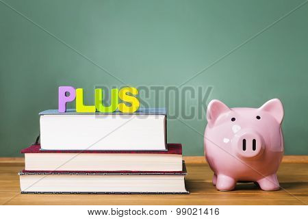 Federal Plus Loan Theme With Textbooks And Piggy Bank