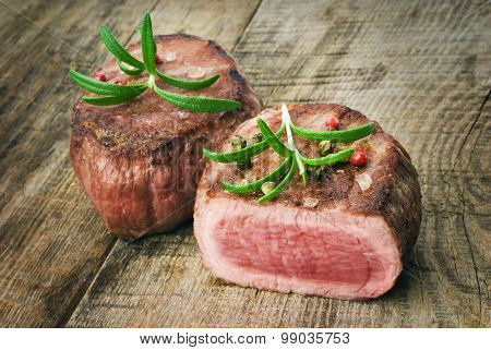 Delicious beef steak on wooden table