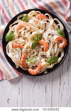 Fettuccini Pasta In Cream Sauce With Shrimp On A Plate. Vertical Top View