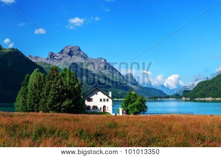 Amazing sunny day at Champferersee lake in the Swiss Alps. Silvaplana village, Switzerland, Europe.