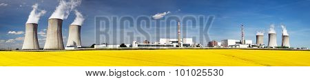 Nuclear Power Plant Dukovany With Golden Glowering Field
