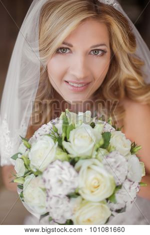 Beautiful Smiling Bride Girl With Wedding Bouquet Of Flowers.