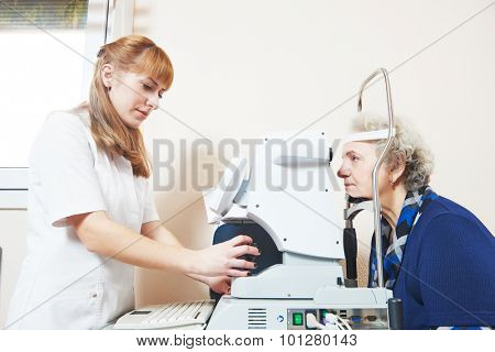 Adult optometry. female optometrist optician doctor examines eyesight of woman patient in eye ophthalmological clinic 
