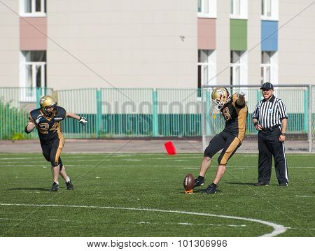 RUSSIA TROITSK CITY - JULY 11: Sergey Kalashnikov (8) on free shot during Russian american football Championship game Spartans vs Raiders 52 on July 11 2015 in Moscow region Troitsk city Russia