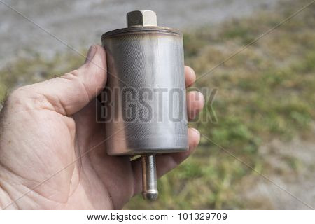 Mechanic Examining A New Gas Filter