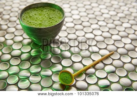 Matcha green tea from Japan on modern stainless steel background