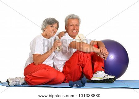 Elderly couple having rest of gym