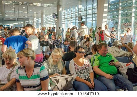Tivat, Montenegro - September 11, 2015: People Sitting In The Relegation Zone , Waiting For Their Fl