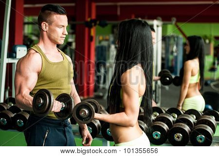 Fitness Youple Workout - Fit Mann And Woman Train In Gym