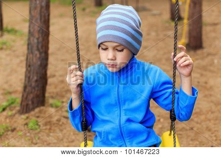 Bored boy in the park