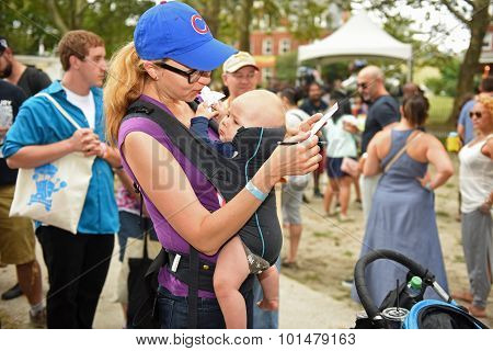 Woman with baby marks her ballot