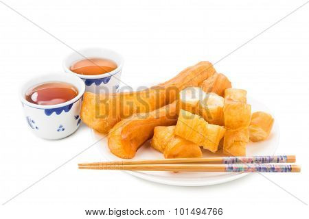 Fried Bread Stick Or You Tiao Served With Chinese Tea.