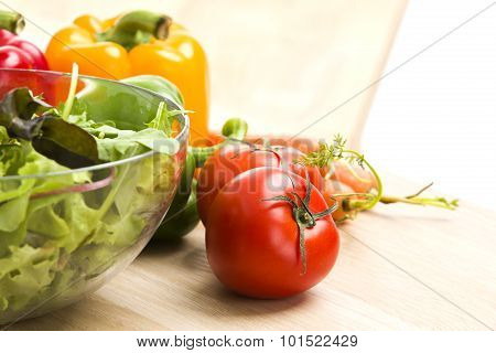 Mix Of Vegetables On Salad On Wood Background.