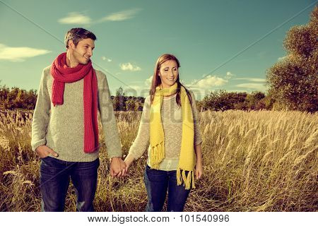 field walking couple in colder season