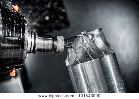 Metalworking CNC milling machine. Cutting metal modern processing technology. Small depth of field. Warning - authentic shooting in challenging conditions. A little bit grain and maybe blurred.