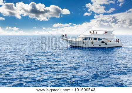 White yacht in the blue tropical sea