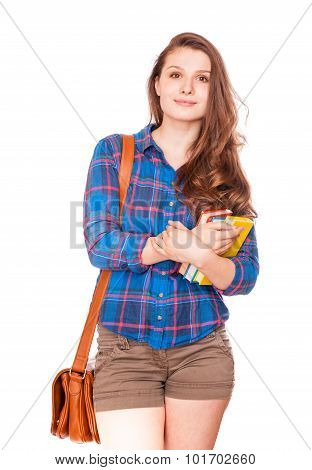 Happy young student girl holding books high school or college graduand cute casual teenager smiling