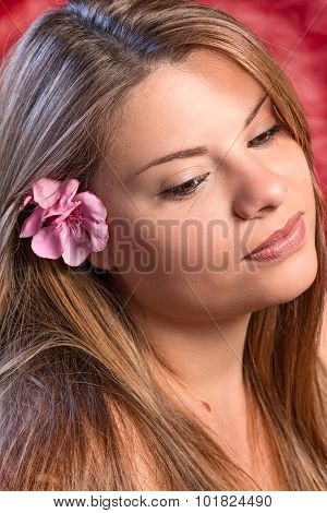 blond girl with pink flower